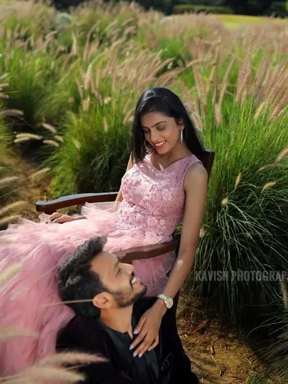 A tender moment captured between the couple in a beautiful outdoor setting, surrounded by nature. This pre-wedding portrait feels intimate and genuine.