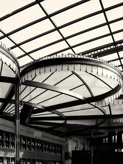 The overlapping forms of the canopy lights, viewed from below. This abstract perspective highlights their sculptural quality.
