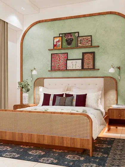 A bedroom should be a personal sanctuary. This ethnic-inspired master bedroom combines a custom cane and wood bed frame with a serene, textured green accent wall. The space is a perfect blend of traditional craftsmanship and modern comfort, creating a colorful yet calming retreat.