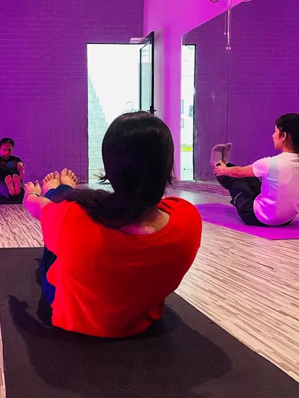 The boat pose (Navasana) is a fantastic exercise for strengthening the core and hip flexors. You can see the determination and focus as my students hold the pose during a group session.