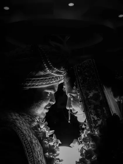 Sometimes, the most powerful emotions are captured without color. This intimate black and white portrait of the bride and groom shows my style of using dramatic lighting to create a timeless, emotional image focused purely on their connection.