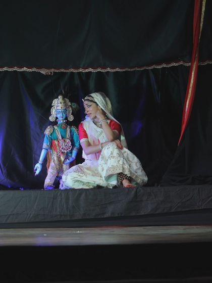 A live performance of 'Giridhar Naagar Ki Meera' at the Meera Mahotsav in Dwaraka, Gujarat. Here, a dancer performs alongside the puppet of Lord Krishna, creating a beautiful dialogue between the human and the divine.