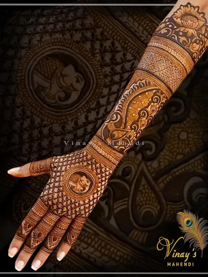 A detailed back-of-hand design with a central elephant motif in a square frame, surrounded by intricate check patterns.