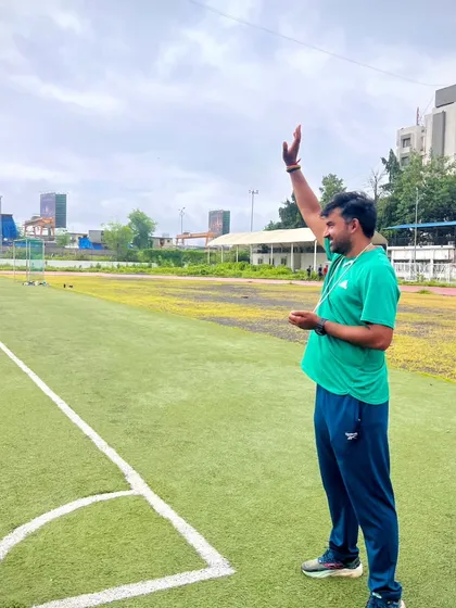 Instructing my athletes from the sidelines. Clear communication and direction are key during a complex training session.