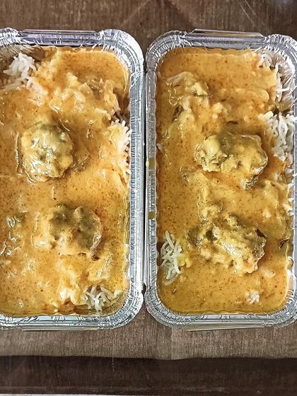 Two boxes of our delicious Kadi and Rice combo. The soft pakodas soaked in tangy kadi are a treat for your taste buds.