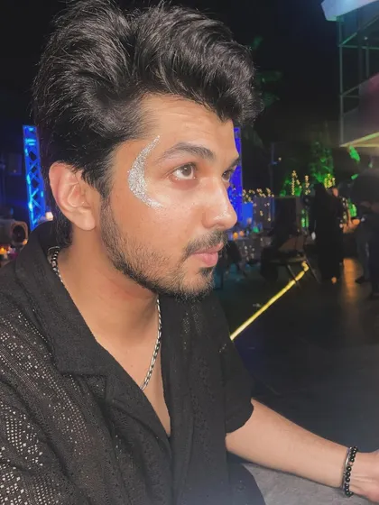 A clean and cool silver glitter crescent design for men. This shows how a simple touch of sparkle can elevate anyone's look for a party or music festival.