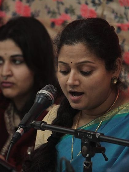 A female vocalist presenting her recital at the 'Raghunathanjali' event.