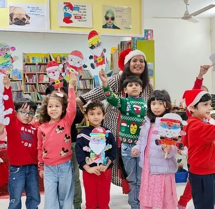 Look at these proud faces! The children are so happy to display their handmade Santa crafts. These activities are not just fun; they also build confidence and a sense of accomplishment.