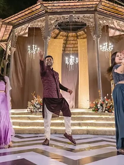 We planned this surprise for the bride where the groom jumped into the middle of a dance performance. It's a fun, high-energy way to kick off the sangeet celebrations.
