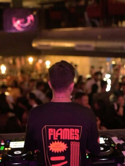 A view from behind the decks during a packed Friday night at Flo.