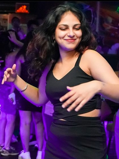 A candid shot of someone dancing at Big Pitcher.