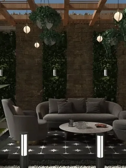 The interior view of the Bulandshahr pergola concept, showing a comfortable seating arrangement surrounded by vertical greenery.