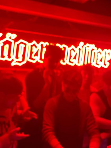 A blurry, red-lit shot from a late-night session. Sometimes the best moments are the ones that are a bit of a blur. New music is on the way.