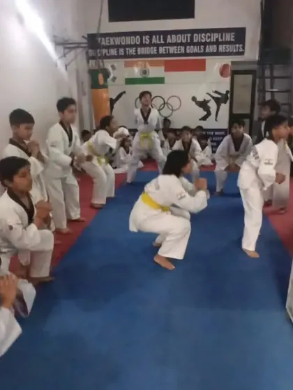 Students performing warm-up exercises during their belt test. Physical conditioning is a part of every evaluation.