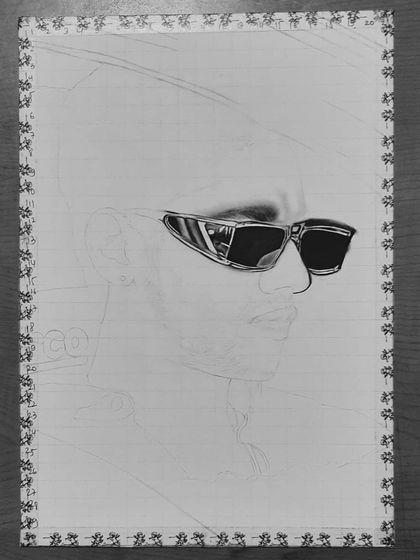 A step-by-step look at my 85-hour portrait of Baseer Ali. You can see the grid lines and how I build up the layers of graphite and charcoal to create a photorealistic effect.