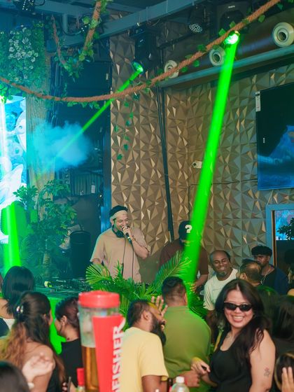 On the mic and interacting with the crowd at Happy Brew. I'm not a DJ who hides behind the decks; I'm right there with you, leading the party.