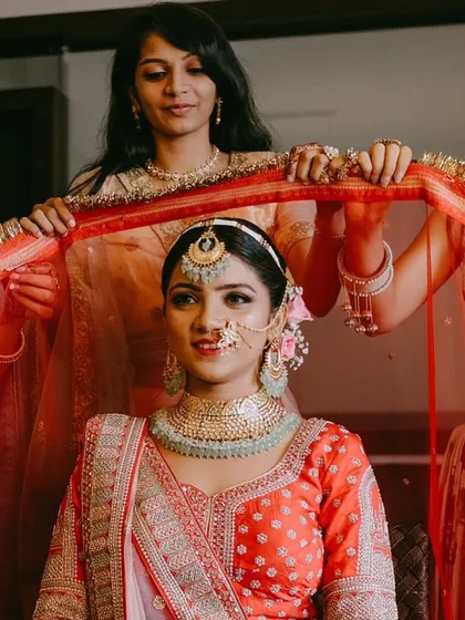 Beyond sarees, I love styling grand lehengas for that quintessential royal Indian bride look. Here, we balanced the rich red lehenga with elegant mint green jewelry and a soft, glowing makeup look, ensuring the bride looked absolutely heavenly.