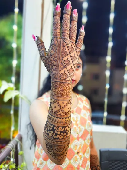 A playful pose showing off the full bridal design, perfect for a modern bride.
