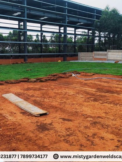 The lawn installation progressing across the large field. We ensure the ground is properly watered as we go to help the new grass establish itself.
