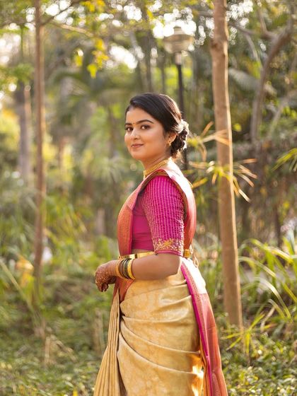A beautiful outdoor portrait from a pre-wedding ritual. The soft, natural light is perfect for showcasing the subtle and elegant makeup.