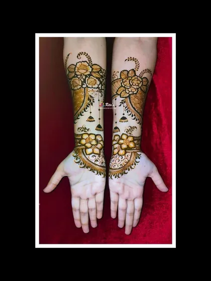 The full view of the floral engagement design, showing how the pattern flows from the arms down to the palms.