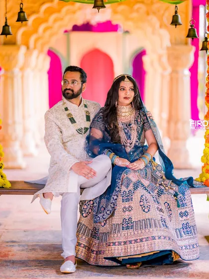 Your pre-wedding shoot should feel as grand as your love story. Here, I used a vibrant, royal backdrop with traditional Indian decor to create a portrait that is both regal and full of personality.