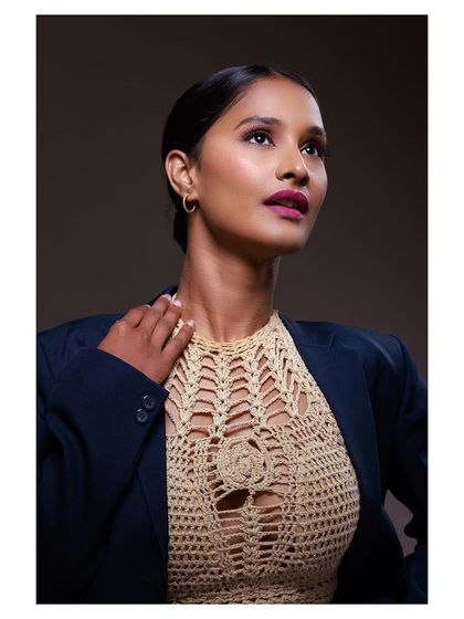 Another shot from the same series, with the model looking up, creating a sense of aspiration and confidence.