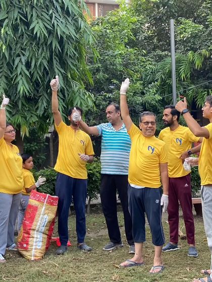 Thumbs up for a successful cleanup. Our team feels proud and energized after making a positive impact on our local surroundings.