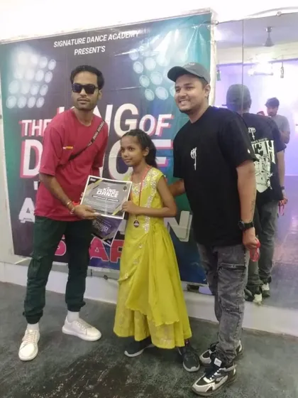 One of our students with her certificate from "The King of Dance" auditions. She performed beautifully and earned her spot.