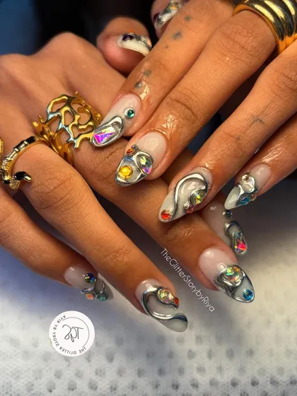 Making a statement with bold, sculpted silver 3D art. This set features abstract metallic shapes and multi-colored crystals for a futuristic and edgy look, perfect for anyone wanting to stand out.