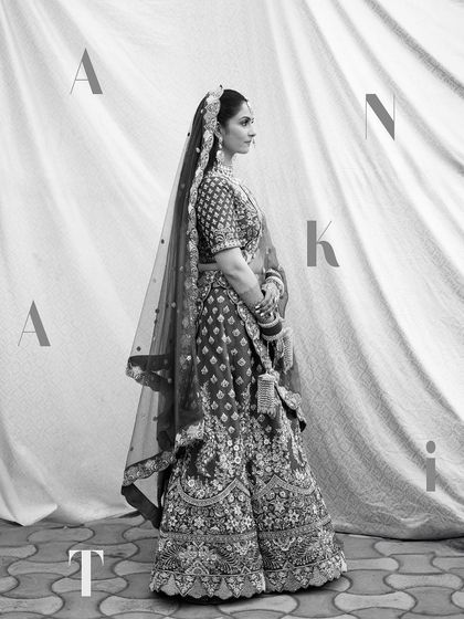 A stylish black and white full-length portrait with the bride's name artistically placed.