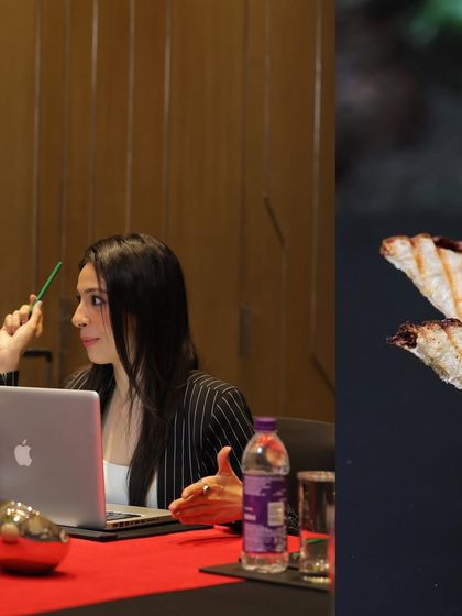 A professional works on her laptop in a dedicated meeting space. Our facilities provide the quiet and focus needed for deep work, presentations, and strategic planning, free from distractions.