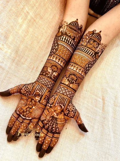 A beautiful bridal design with bride and groom portraits on the palms, surrounded by traditional motifs like the tree of life and swans.