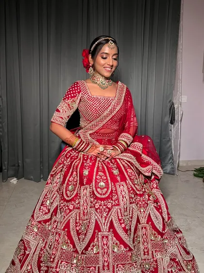 Another full-length shot capturing the grandeur of the bridal lehenga and the elegance of the overall look.