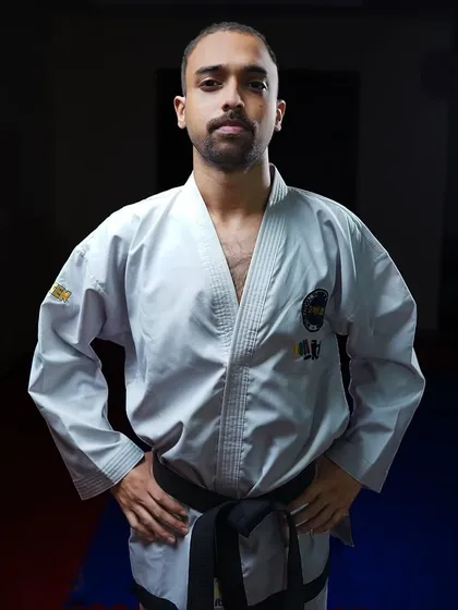 A portrait in my dobok at the academy. For me, martial arts is a discipline that requires continuous study and dedication, a philosophy I bring to every training session.