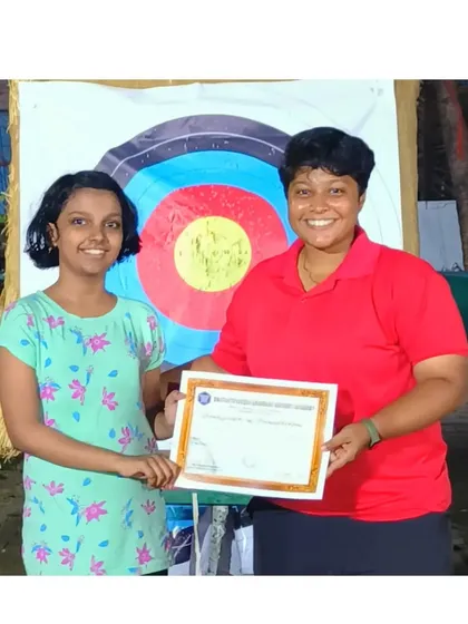 This student receives her certificate from one of our coaches after a successful summer camp.