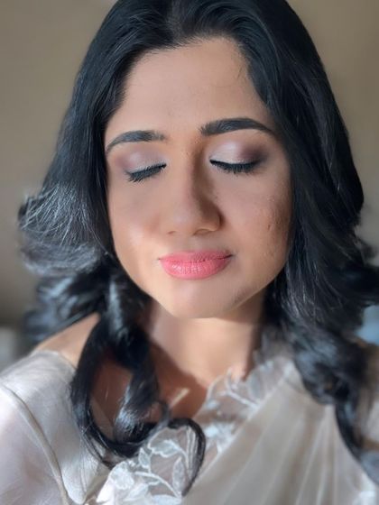 A beautiful, natural makeup look for a client attending her daughter's baptism. The focus is on soft, neutral tones for the eyes and a peachy-pink lip.
