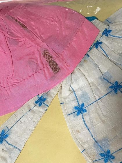 A close-up from my mother's 1963 journal, showing a miniature blouse with delicate embroidery. The skill and precision, even in these small samples, is incredible.