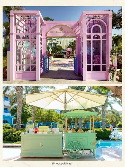 A split view of the grand pink entrance gate for the "Victorian Luncheon" and the charming pastel green food carts, showcasing the event's whimsical and cohesive theme.