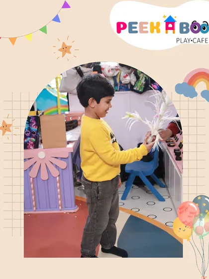The birthday boy, Ahaan, participating in the magic show at his party.