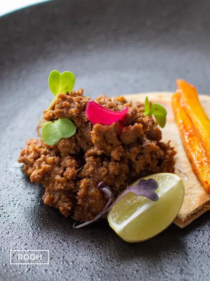 Slow-flame cooked Qeema Birhayi with raw mango. This dish is a testament to the slow cooking techniques of Awadhi cuisine, resulting in incredibly tender and flavorful meat.