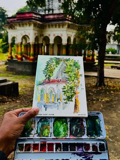 My finished watercolor sketch of the temple in Nagpur, held up against the real thing. I tried to capture the way the leaves framed the beautiful architecture.