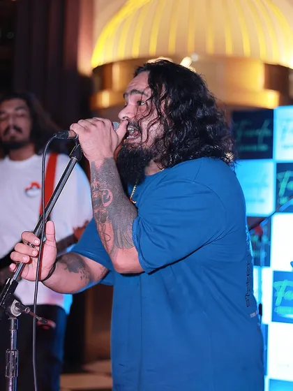 A side profile of our frontman, singing his heart out. You can see the passion and dedication in this shot.