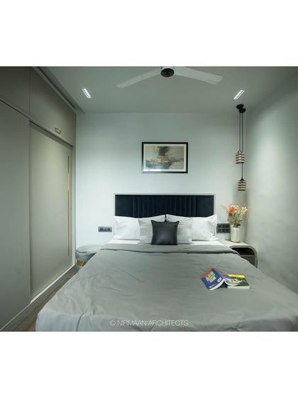 The master bedroom at Tulsi Heights is a study in calm. The simple color palette, clean lines of the wardrobe, and soft lighting create a space that feels like a deep, relaxing slumber.