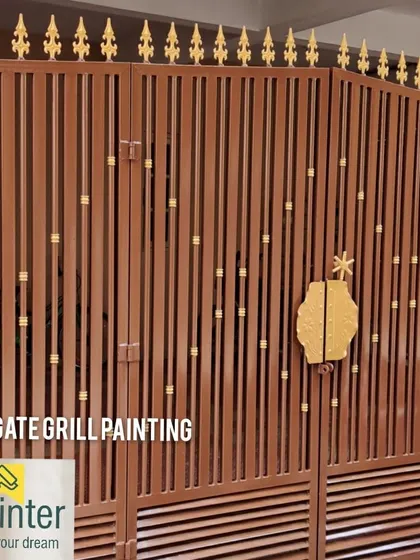 This main gate was treated with a protective brown paint and finished with elegant gold accents. Our metal painting service prevents rust and gives your entrance a distinguished look.