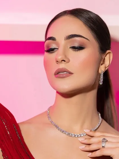 An eyes-closed portrait, highlighting the soft, glamorous eye makeup. This is a key part of the overall red carpet look I create.