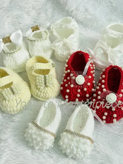A beautiful collection of my various baby shoe designs, showcasing different styles, colors, and embellishments like bows, pearls, and crystals.