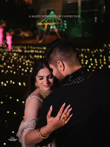 For engagement shoots, we focus on creating an atmosphere of romance and connection. This intimate portrait, set against a backdrop of soft lights, highlights the couple's quiet chemistry.