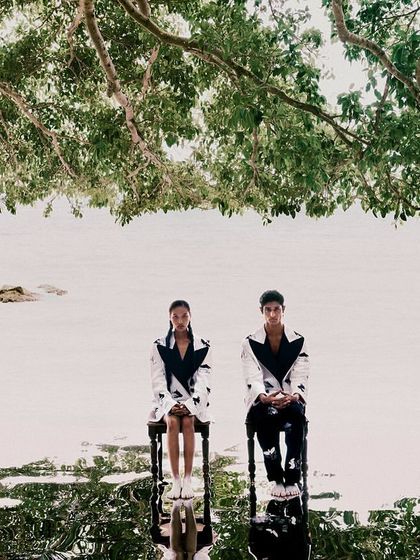 Another surrealist concept for 'All Beneath Heaven', with two models sitting on chairs in the water. The reflection creates a perfect, symmetrical dreamscape.