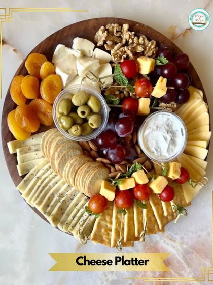 A top-down view of our elegant Veg Cheese Platter. This vibrant spread includes artisanal cheeses, fresh fruits, olives, nuts, and a variety of crackers, perfect for any gathering.